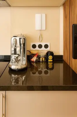 a kitchen counter with a toaster and other items on it at Mounir Hamari in Marrakech