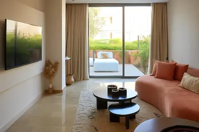 a living room with a couch and a table at Mounir Hamari in Marrakech