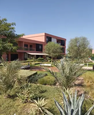 a building with a garden in front of it at Mounir Hamari in Marrakech