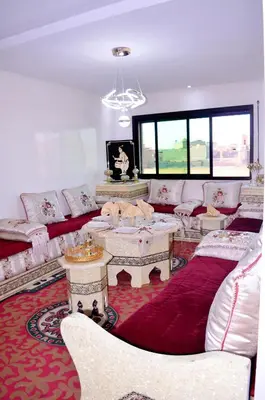 a living room with couches and tables in a room at Elegant Apartment with Moroccan Charm in Marrakech