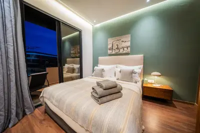 a bedroom with a large bed with towels on it at Modern Moroccan Apartment in Gueliz with Terrace in Marrakech