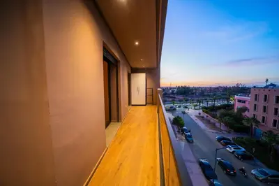 a balcony of a building with a view of a street at Modern Moroccan Apartment in Gueliz with Terrace in Marrakech