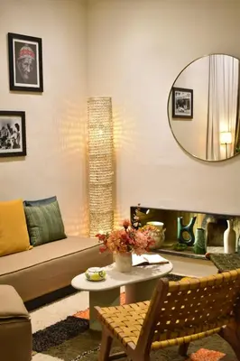 a living room with a couch and a mirror at Maison Etchika in Marrakech
