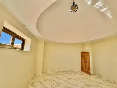 an empty room with a ceiling and a window at Stylish Atlas Golf Resort Getaway - Free Breakfast, Rooftop Patio, Pool, Views in Marrakech