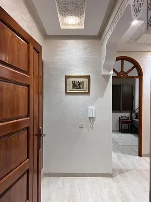 a hallway with a door and a room at Omar Hachoum in Marrakech