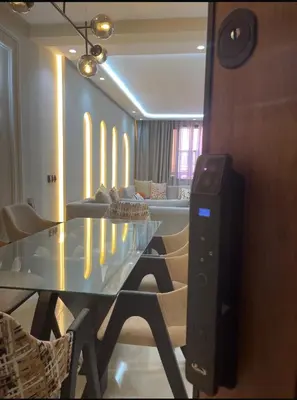 a living room with a glass table and a couch at Welcome to your peaceful getaway in Marrakech! in Marrakech