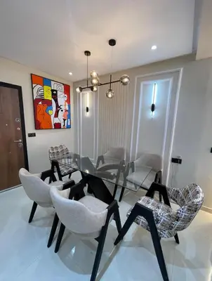 a dining room with a glass table and chairs at Welcome to your peaceful getaway in Marrakech! in Marrakech