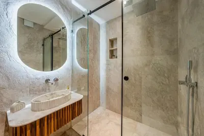 a bathroom with a sink and a glass shower at Le Nahla - Centre - 4 Prs - Terrasse in Marrakech