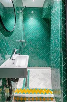 a green tiled bathroom with a sink and a shower at Casa Coloré terrace and bohemian charm in Marrakech