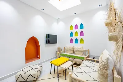 a living room with a yellow table and chairs at Casa Coloré terrace and bohemian charm in Marrakech
