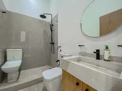 a bathroom with a sink and a toilet and a mirror at Argan golf in Marrakech