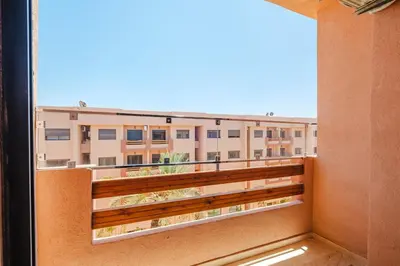 a balcony with a view of a building at Modern 2 bedroom apartment Marrakech in Marrakech