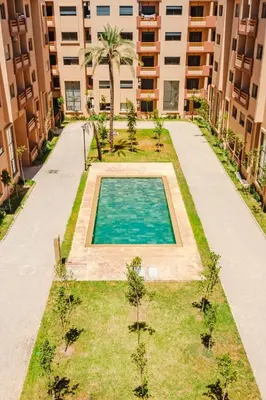 a swimming pool in the middle of a building at Modern 2 bedroom apartment Marrakech in Marrakech