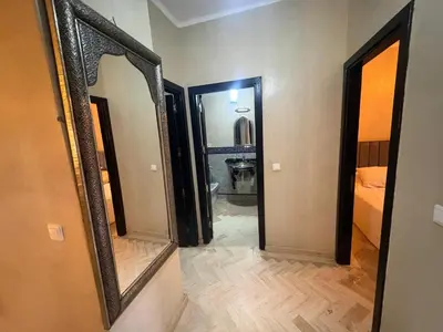 a hallway with a mirror in a room at Atlas golf resort beldi chic piscine in Marrakech