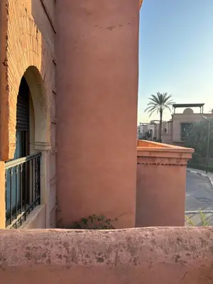 a corner of a building with a window at Atlas golf resort beldi chic piscine in Marrakech