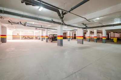 an empty parking garage with a car parked in it at Modern Studio with Pool in Marrakech