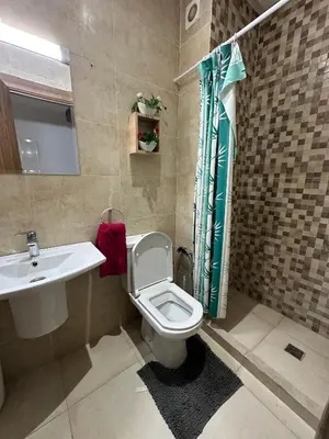 a bathroom with a toilet and a sink at 3wina immobilier in Marrakech