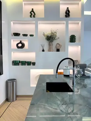 a kitchen with a sink and some plants on a wall at Palais Oyena in Marrakech