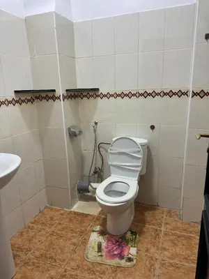 a bathroom with a toilet and a sink at 2 BR APP Gueliz Pool Ac Wifi in Marrakech