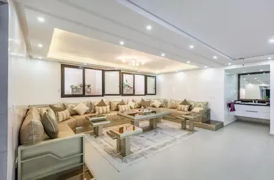 a large living room with a couch and a table at Luxury 4-ROM Villa with private Heated pool in Akenza ,free Airport transport service in El Rhechat