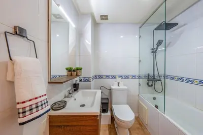 a bathroom with a sink and a toilet and a shower at Luxury 2BR Apt in Gueliz, Pools, Parking,Elevator in Marrakech