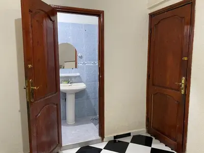 a bathroom with a sink and a mirror at Garden View Comfort Apartment in Marrakech