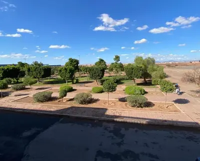 a view of a park with trees and bushes at Garden View Comfort Apartment in Marrakech
