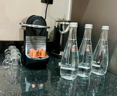 a group of bottles of water on a counter at Appartement Confort & Sérénité Mabroka Marrakech in Marrakech