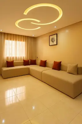 a living room with two couches and a circular ceiling at Appartement Confort & Sérénité Mabroka Marrakech in Marrakech