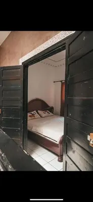 a bedroom with a bunk bed in a room at chambres Marrakech in Marrakech