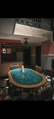 a table in a room with a table cloth on it at chambres Marrakech in Marrakech