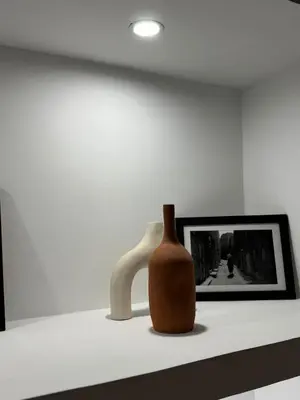 a vase sitting on a shelf next to a picture at Villa Selma piscine privée sans vis à vis 9 min du centre in Marrakech