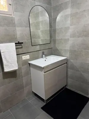 a bathroom with a white sink and a mirror at Villa Selma piscine privée sans vis à vis 9 min du centre in Marrakech