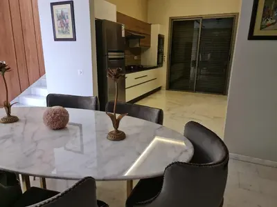 a dining room with a table and chairs at Villa Starlight in Marrakech