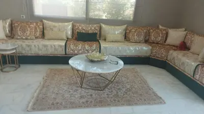 a living room with a couch and a table at Villa Starlight in Marrakech