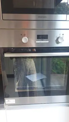 a microwave oven with a persons foot inside of it at Villa Starlight in Marrakech