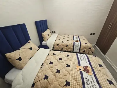 a bedroom with two beds with quilts at Central Bright Comfortable in Marrakech