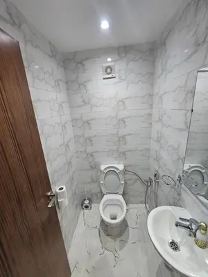 a bathroom with a toilet and a sink at Central Bright Comfortable in Marrakech