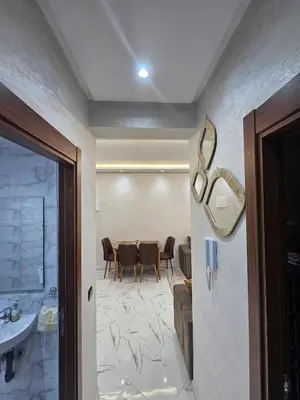 a dining room with a table and chairs at Central Bright Comfortable in Marrakech