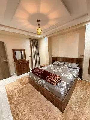 a bedroom with a large bed in a room at حدائق حي شريفية بوعكاز مراكش in Marrakech