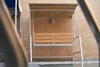 an overhead view of a wooden bench against a building at la villa cozy in Marrakech