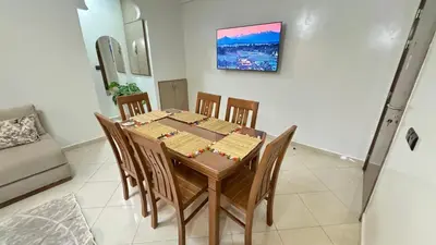 a dining room with a table and chairs at Private Apartment Near Marrakech Airport in Marrakech