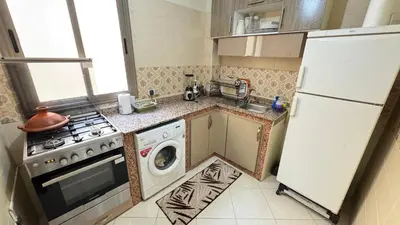 a kitchen with a white refrigerator and a washing machine at Private Apartment Near Marrakech Airport in Marrakech