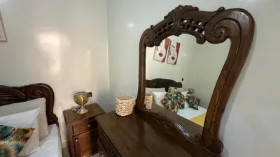 a bedroom with a large mirror on a bed at Private Apartment Near Marrakech Airport in Marrakech