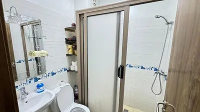 a bathroom with a shower and a toilet and a sink at Private Apartment Near Marrakech Airport in Marrakech