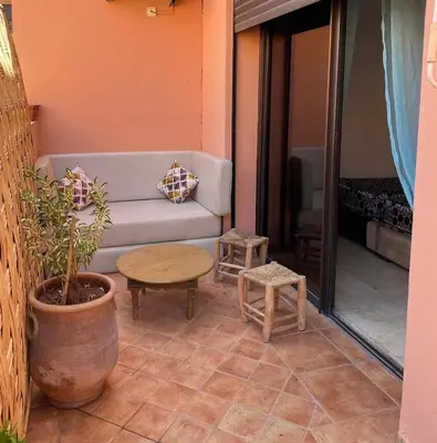 a living room with a couch and a table at Appartement en plein cœur de Marrakech in Marrakech