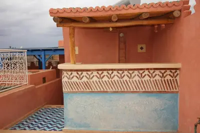 a balcony of a house with a roof at Palais el Abbassia in Marrakech