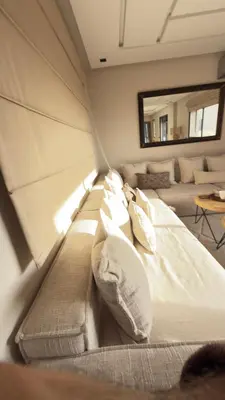 a large bed in a room with a couch at Calm Cozy Blue Loft Modern Stay in Marrakech