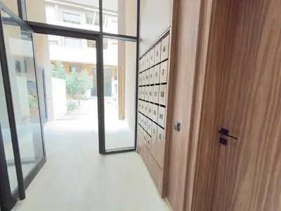 a hallway with a door and a wall with writing on it at Calm Cozy Blue Loft Modern Stay in Marrakech