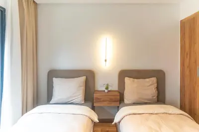 two beds sitting next to each other in a room at AyaMi Marrakech Luxury Stay in Marrakech